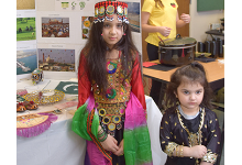 Two African Road Elementary students wear beautiful dresses from Pakistan.