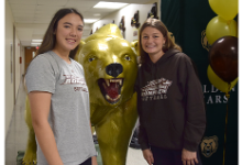 Vestal High School softball teammates Kymora Wang and Kelsey Brady take their place by the Golden Bear statue before their signing ceremony on November 9, 2022.