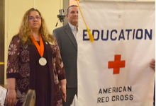 Vestal Middle School Nurse Michelle Hroncich proceeds into the ballroom at the Binghamton DoubleTree at the beginning of the Southern Tier Red Cross Real Heroes Breakfast.