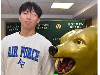 Sammy Baek, Vestal High School varsity lacrosse player, stands next to the Golden Bear statue wearing an Air Force sweatshirt before his National Letter of Intent signing on January 17, 2024.