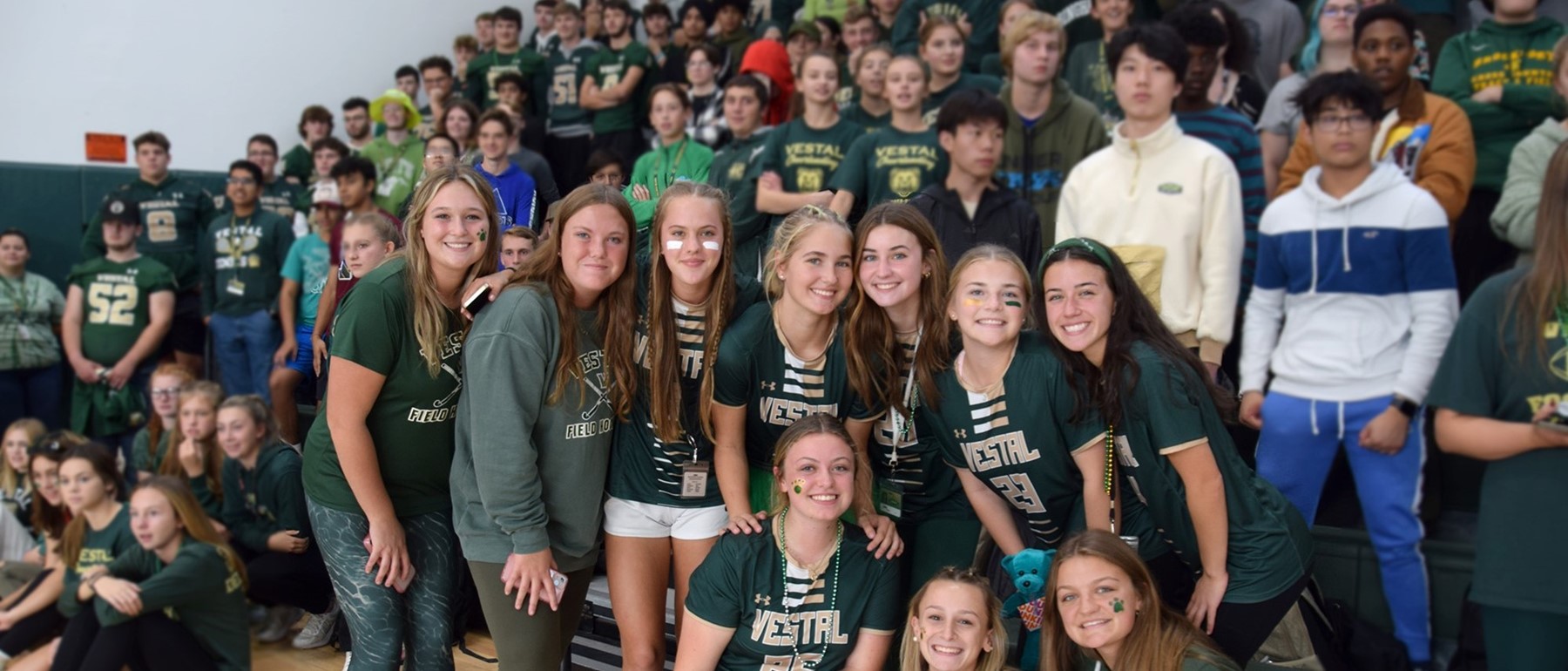 Vestal High School juniors dressed in green celebrate during the Fall 2022 Pep Rally in the gym.