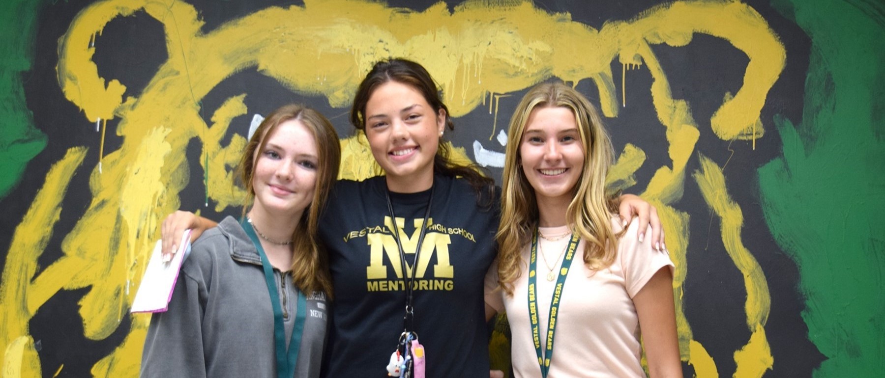 A Vestal High School student mentor poses with her two ninth-graders that she will be mentoring throughout the 2022-23 school year.