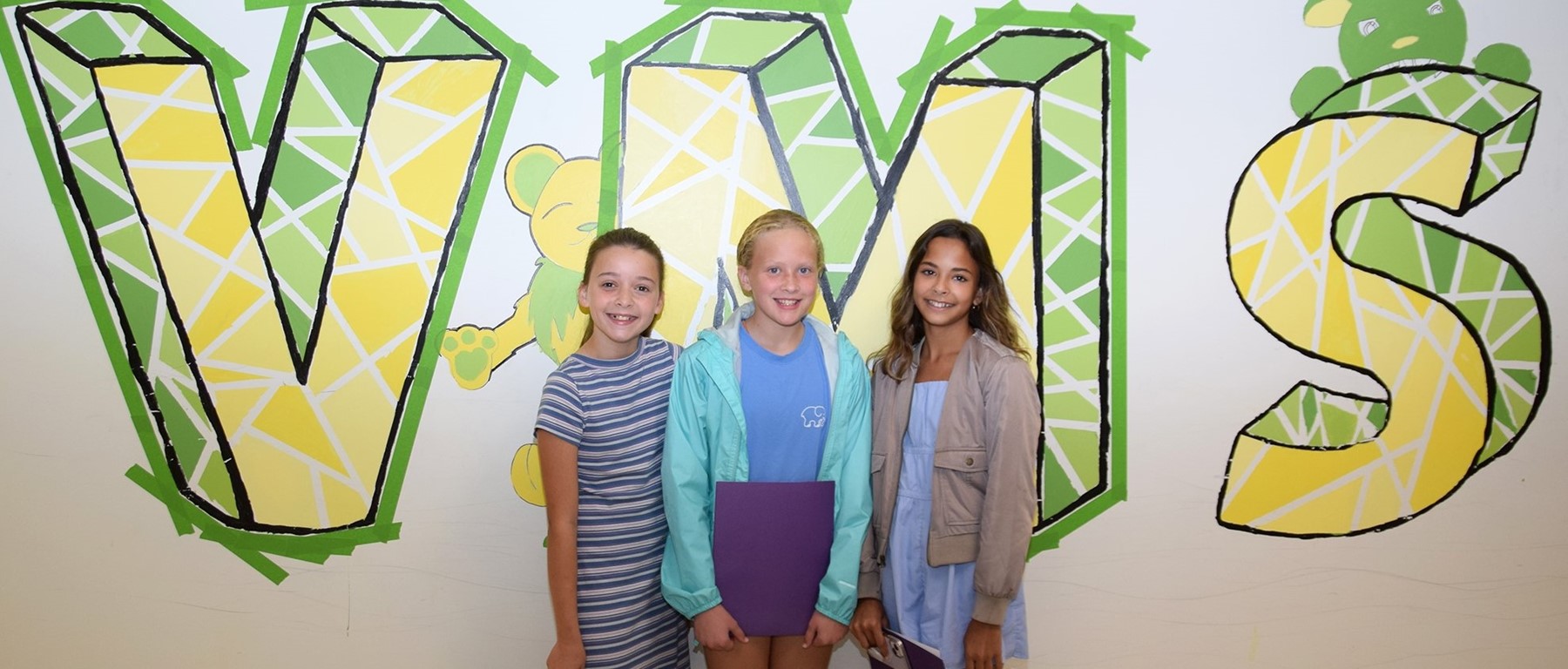 Three Vestal Middle School sixth-graders meet up at Orientation.