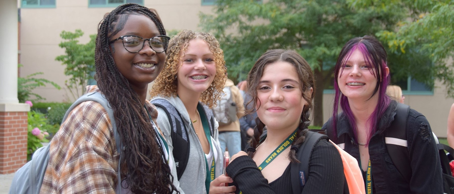 Four ninth-grade friends meet up outside Vestal High School on the first day of classes for 2023-24.